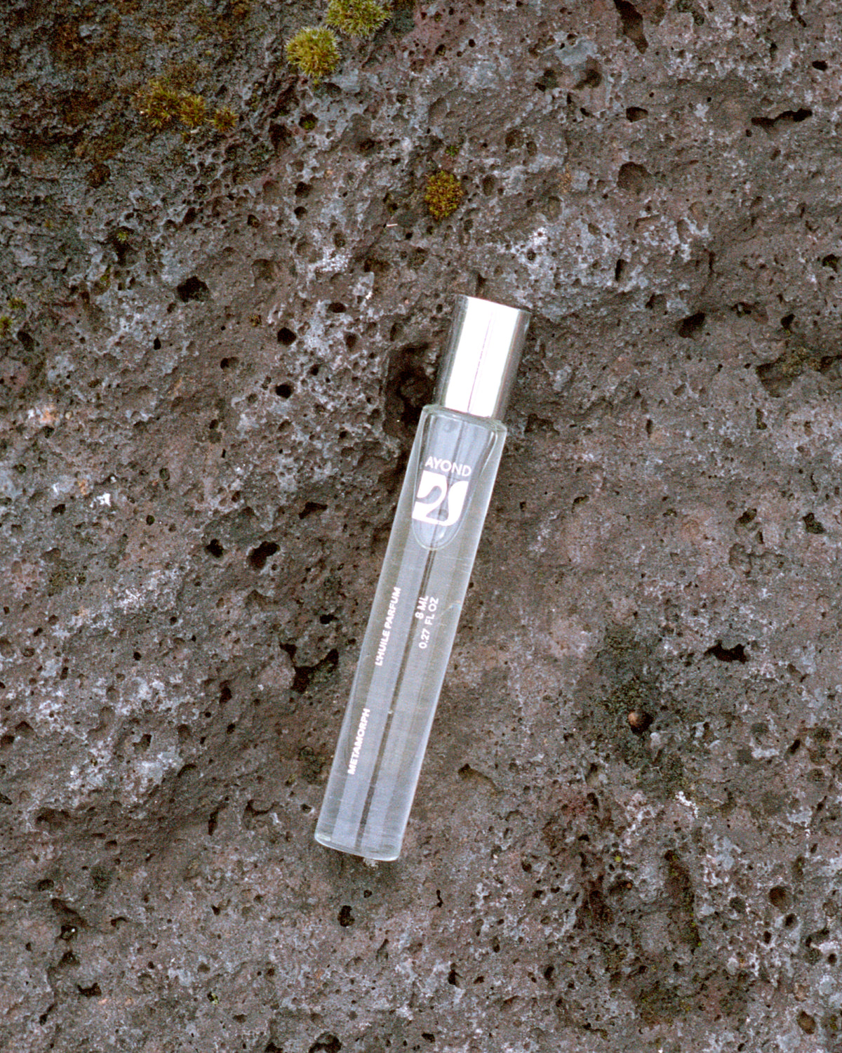 AYOND perfume oil rollerball on textured stone