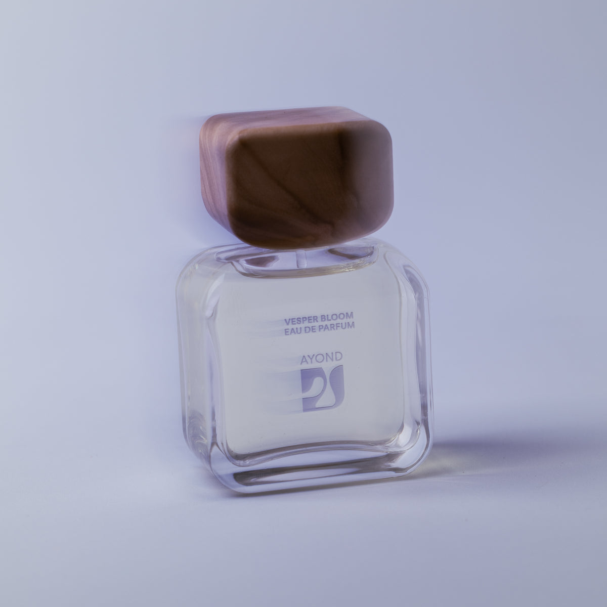 Vesper Bloom Eau de Parfum bottle with olive wood cap