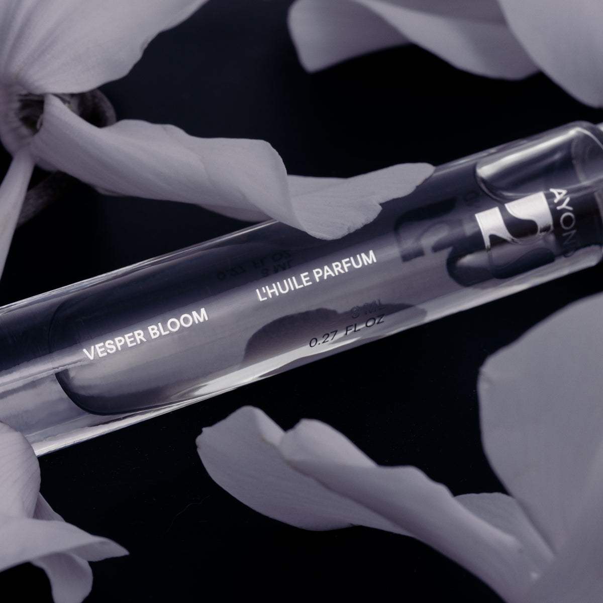 Vesper Bloom Perfume Oil rollerball among the shadows of leaves