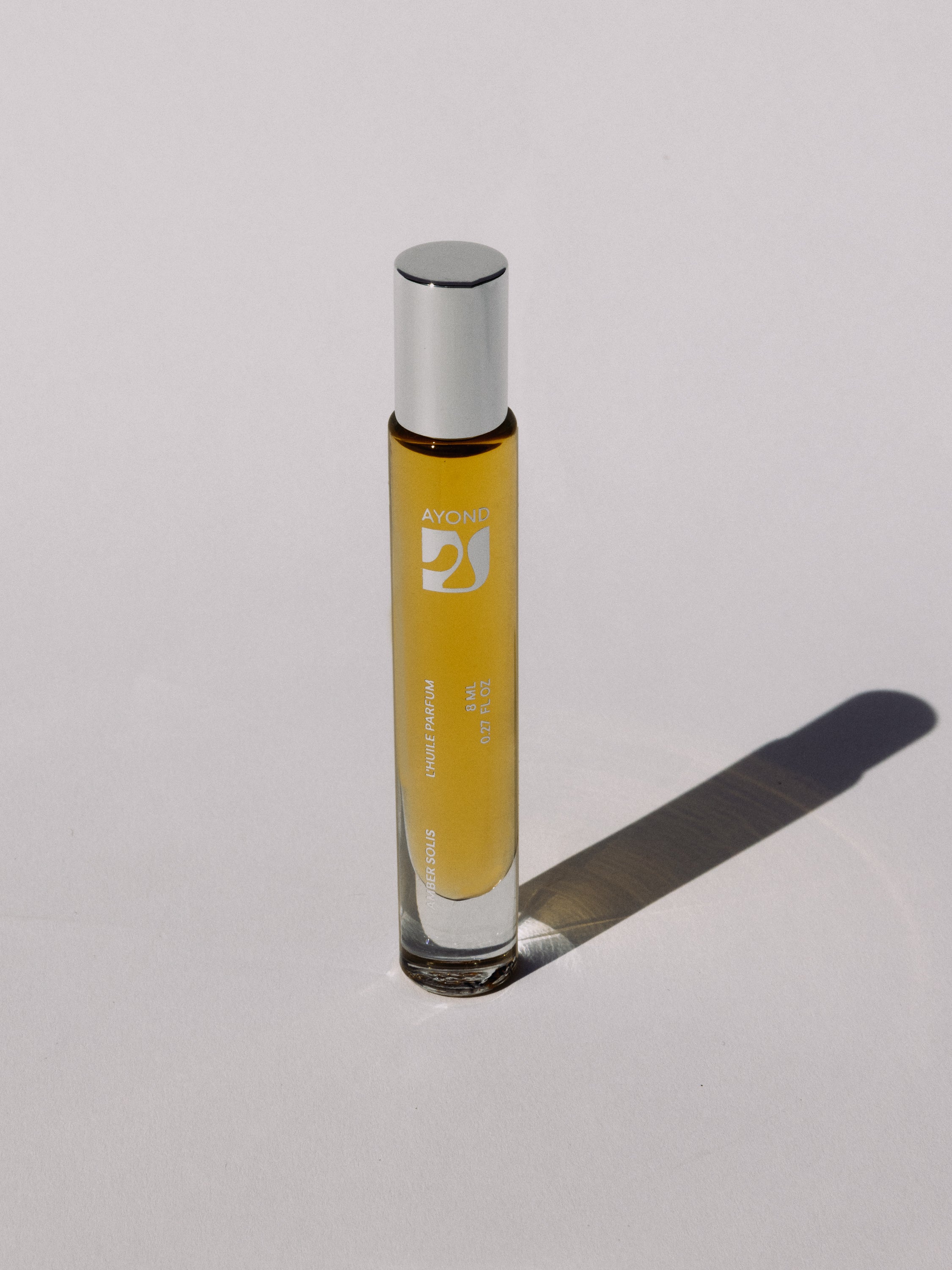 Amber Solis Perfume Oil rollerball standing upright