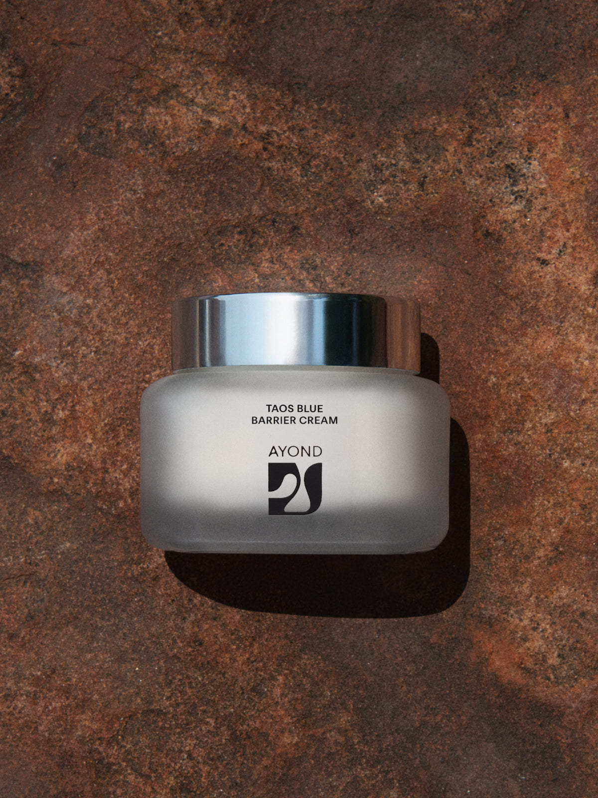 Taos Blue Barrier Cream jar on stone