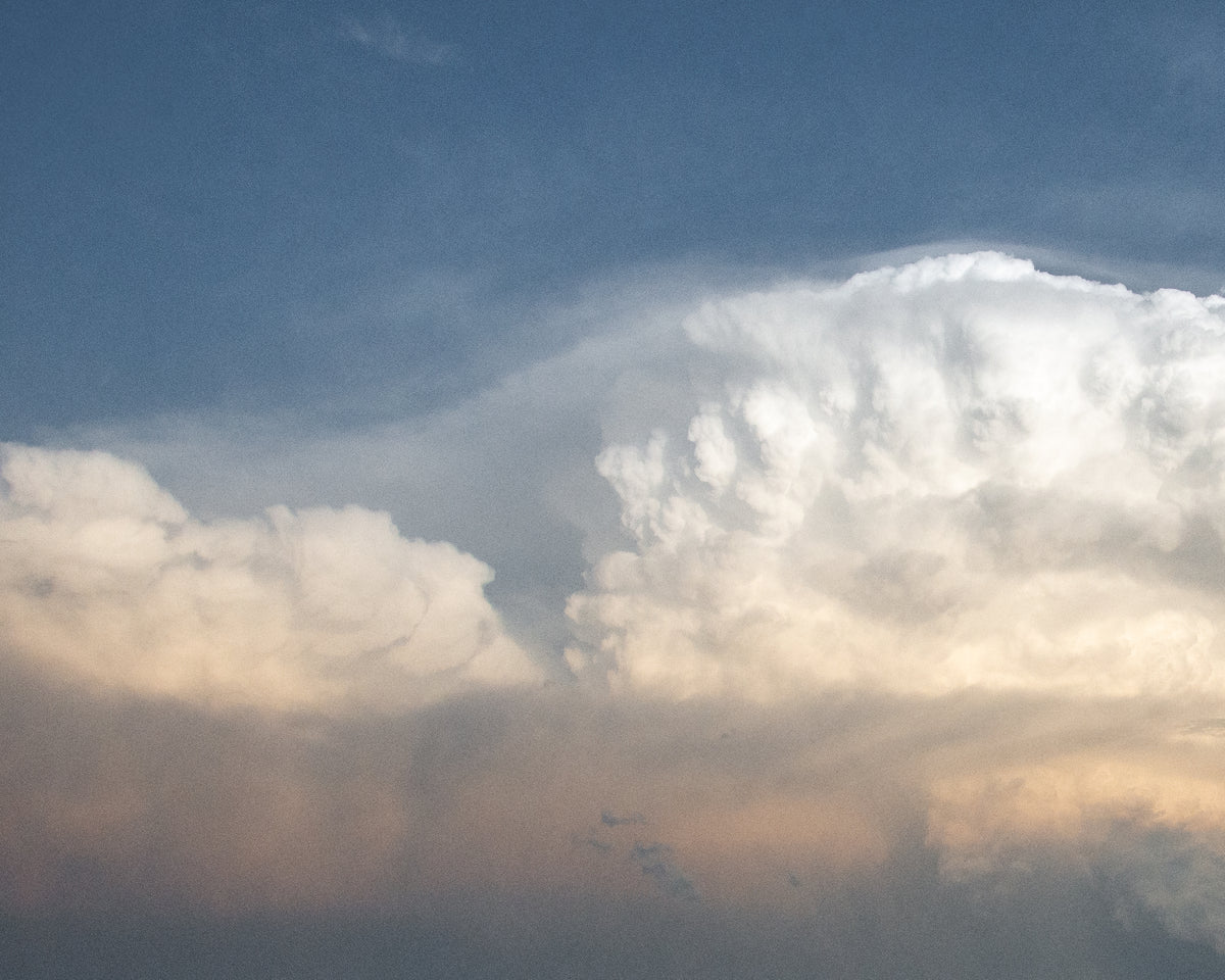 Towering white clouds in a blue sky